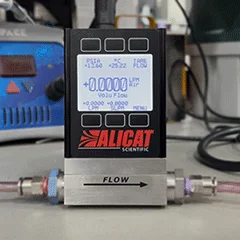 Sequence of images that demonstrates the backlit display on an Alicat instrument turning on and off
