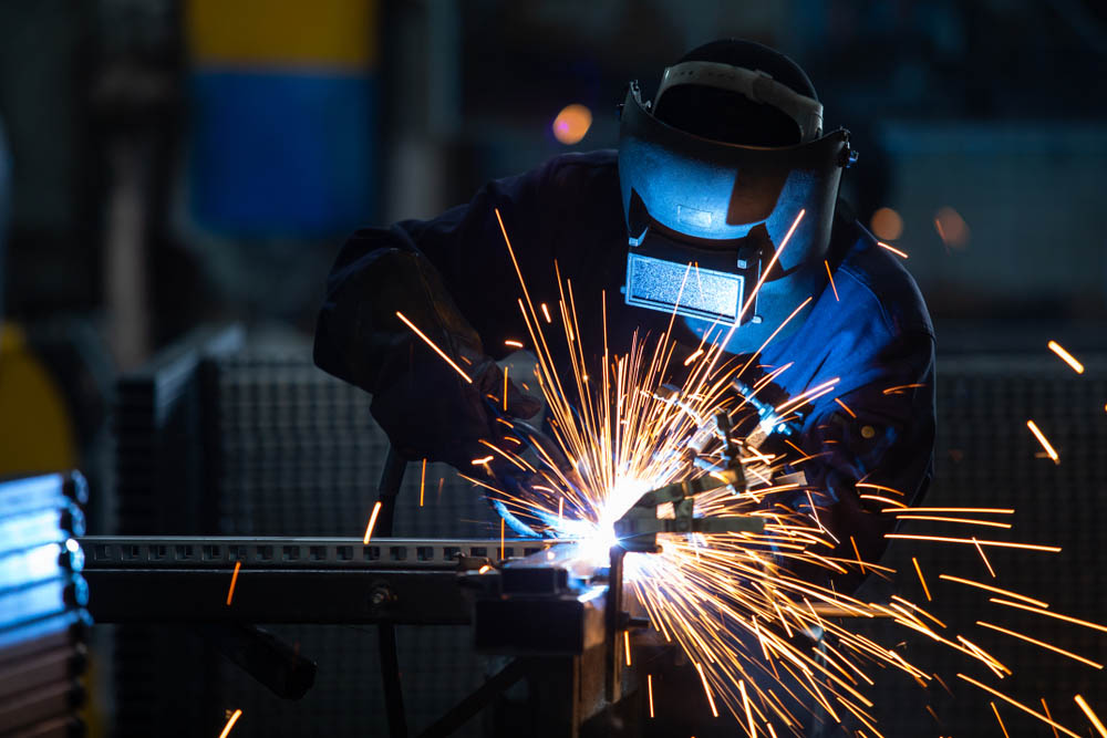 Photo of a welder welding