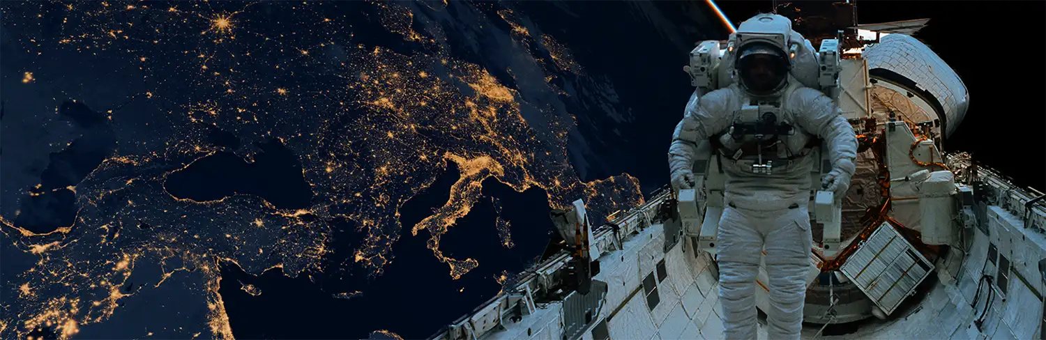 Image of an astronaut outside the space shuttle orbiting the earth