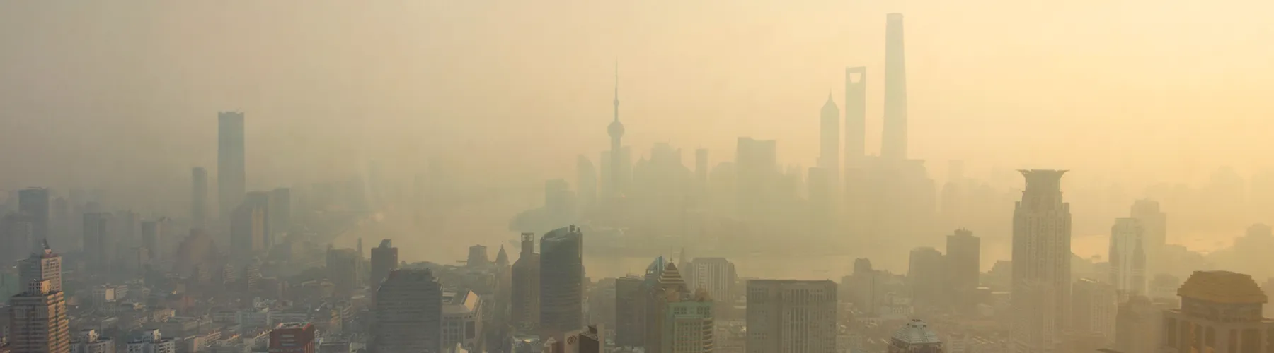 Photo of a city skyline obscured by air pollution