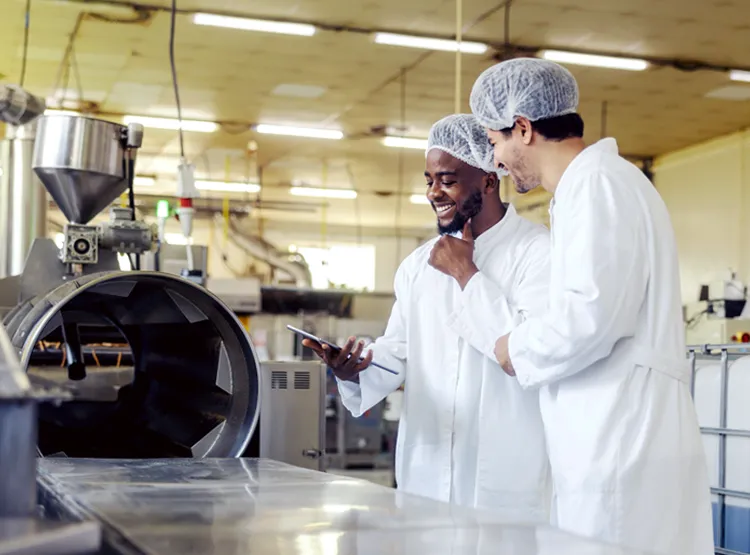 Photo of employees in a food packaging facility