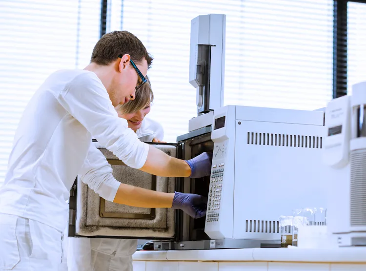 Photo of scientists in a gas chromatography lab
